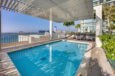 a swimming pool on the roof of a building at Emaar Beachfront - Beach Vista Tower, Dubai Marina in Dubai
