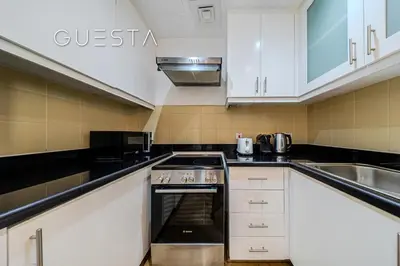 a kitchen with a stove and a sink at Jumeirah Beach Residence - Bahar 6, Dubai Marina in Dubai