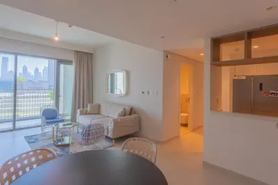 a living room with a table and a couch at BellaVista Downtown Views II T1 - 2 bedroom apartment with Burj Khalifa View in Dubai
