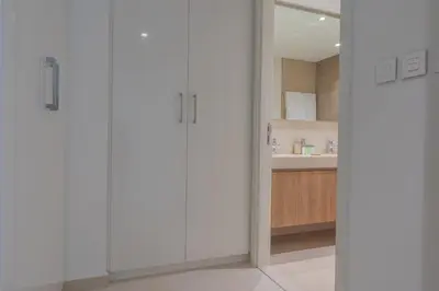 a bathroom with white cabinets and a sink at BellaVista Downtown Views II T1 - 2 bedroom apartment with Burj Khalifa View in Dubai