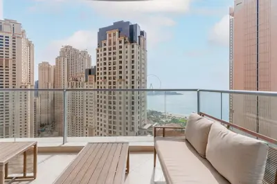 a balcony with benches and a view of the city at Newly Designed 3 beds w marina eye view in Dubai