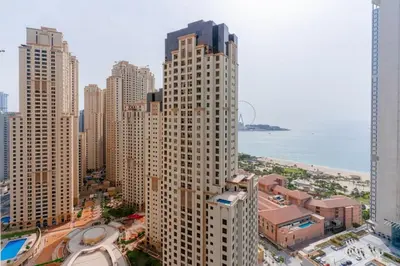 an aerial view of a city with tall buildings at Newly Designed 3 beds w marina eye view in Dubai