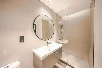 a bathroom with a sink and a mirror at Urban Skyline City Comfort Studio in Dubai
