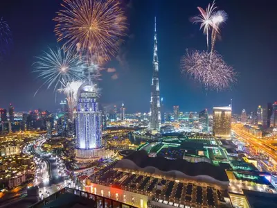 a view of a city with fireworks in the sky at Daniels Burj Khalifa View 2BR at Paramount Midtown in Dubai