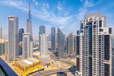 an aerial view of a city with tall buildings at Daniels Burj Khalifa View 2BR at Paramount Midtown in Dubai