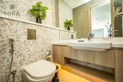 a bathroom with a white toilet and a sink at Mira Holiday Homes - Stylish 1 bedroom in Dubai Marina in Dubai