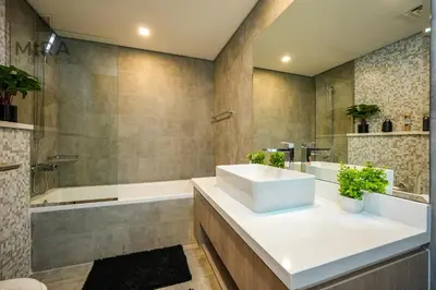 a bathroom with a sink and a shower and a tub at Mira Holiday Homes - Stylish 1 bedroom in Dubai Marina in Dubai