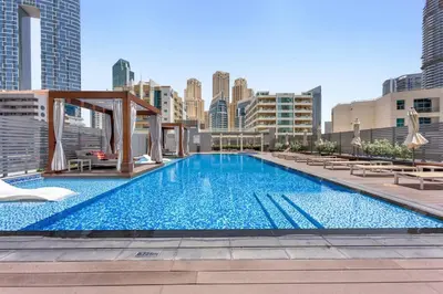 a large swimming pool on top of a building at StoneTree - Studio One Tower Studio - Amazing View and Facilities in Dubai