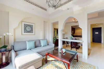 a living room with a couch and a table at Souq Al Bahar - One Bed with Dubai Fountain View in Dubai