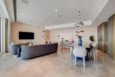 a living room with a couch and a table at FIVE Palm North Residences - Spectacular Three Bedroom in Dubai