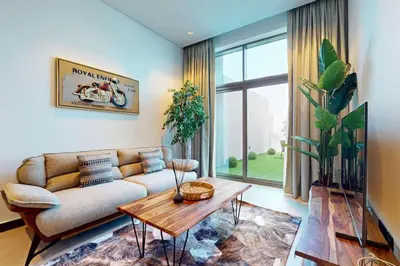 a living room with a couch and a table at 15 Northside Tower 2 - Spacious One Bedroom in Dubai