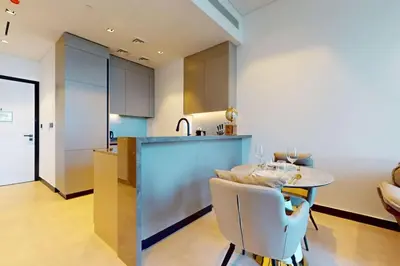 a kitchen with a table and a counter top at 15 Northside Tower 2 - Spacious One Bedroom in Dubai