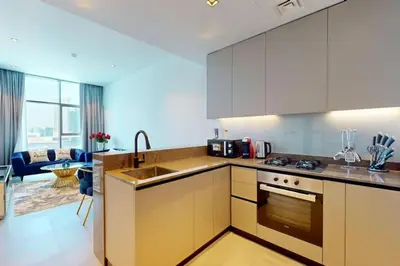 a kitchen with a sink and a stove top oven at 15 Northside Tower 2 - Charming One Bedroom in Dubai