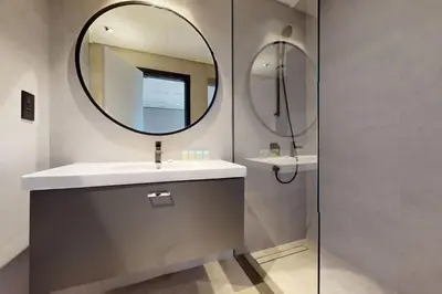 a bathroom with a sink and a mirror at 15 Northside Tower 2 - Charming One Bedroom in Dubai