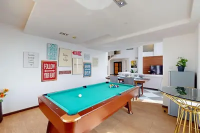 a living room with a pool table in it at Bahar 1 - Opulent Three Bedroom in Dubai
