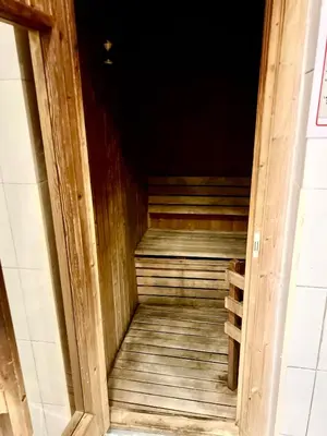 an open door to a room with a wooden stairs at The Waves 241 Dubai Marina in Dubai