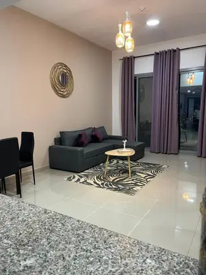 a living room with a couch and a table at SEASONING STAY AT DUBA MARINA in Dubai