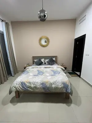 a bedroom with a bed and a mirror on the wall at SEASONING STAY AT DUBA MARINA in Dubai