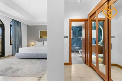 a hotel room with a bed and a bathroom at Keysplease Upgraded 4 BR Beach Villa W Private Beach, Palm in Dubai