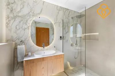 a bathroom with a sink and a mirror at Keysplease Upgraded 4 BR Beach Villa W Private Beach, Palm in Dubai