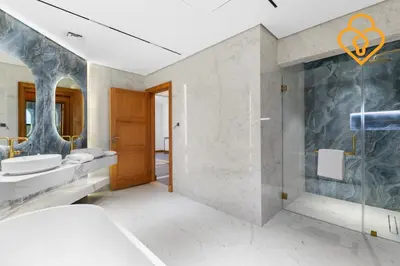 a bathroom with a toilet and a sink and a shower at Keysplease Upgraded 4 BR Beach Villa W Private Beach, Palm in Dubai