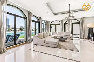 a living room with a white couch and large windows at Keysplease Upgraded 4 BR Beach Villa W Private Beach, Palm in Dubai