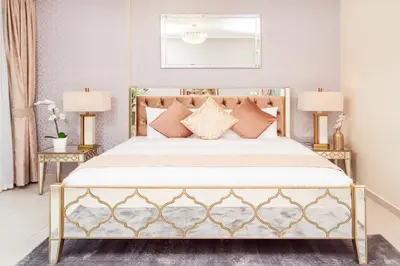 a bedroom with a large bed with two lamps at Elite Royal Apartment - Full Burj Khalifa & Fountain View - Luxurious - Largest Layout - Melchior in Dubai