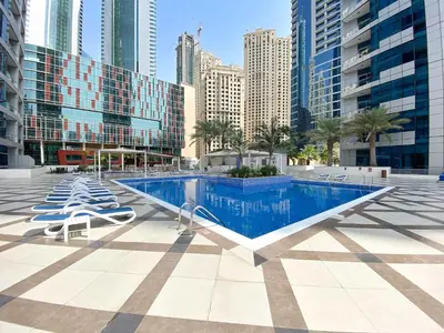 a swimming pool in the middle of a city with buildings at Silkhaus in Bay Central Near Metro in Dubai