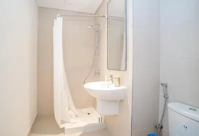 a white bathroom with a sink and a shower at New Arabian Dubai Hills villa- 3 BR & Maid Golf Grove With Private pool in Dubai