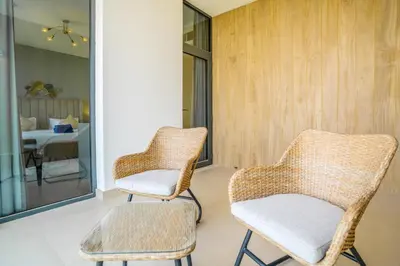two wicker chairs and a table in a room at New Arabian Dubai Hills villa- 3 BR & Maid Golf Grove With Private pool in Dubai