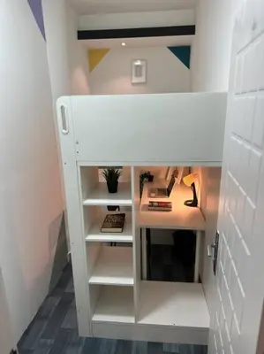 a room with a white closet with a desk at Loft Style Partition Room in Shared Apartment in Al Barsha 1 Near MOE Metro in Dubai