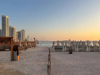 a beach with a group of wooden structures on it at Frank Porter - Seven Hotel & Aprtments in Dubai