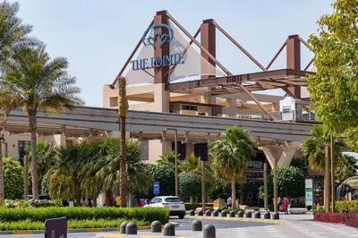a building with a sign on top of it at Frank Porter - Seven Hotel & Aprtments in Dubai