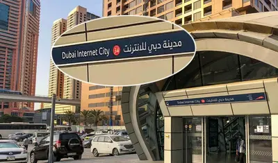 a sign on the side of a building in a city at Luxurious Partition Room in Tecom Near Internet City Metro Station in Dubai