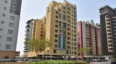 a tall building in a city with tall buildings at Luxurious Partition Room in Tecom Near Internet City Metro Station in Dubai
