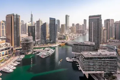 a view of a city with boats in the water at GuestReady - Full Marina View at Bay Central in Dubai