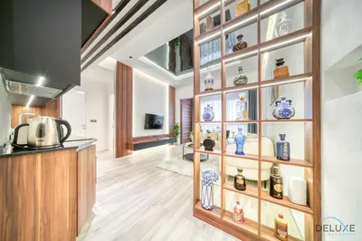 a room with a display case with vases on it at Modern 1BR at Marina Park Dubai Marina by Deluxe Holiday Homes in Dubai