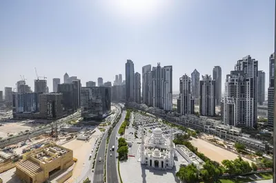 an aerial view of a city with tall buildings at Spacious Studio in Downtown I 8 Boulevard Walk in Dubai