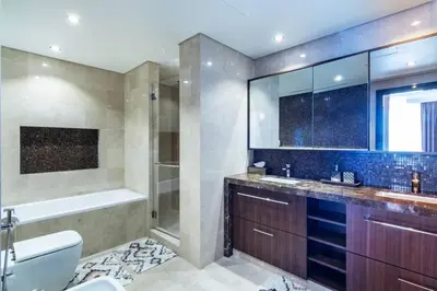 a bathroom with a tub and a toilet and a sink at Triplex Paradise Penthouse in Dubai