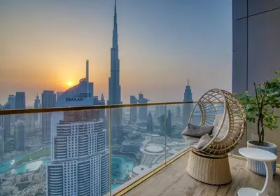 a balcony with a view of a city from a skyscraper at Triplex Paradise Penthouse in Dubai