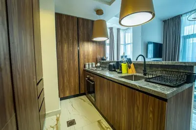 a kitchen with a sink and a counter top at AWS Holiday Homes - Luxurious 2BR in Business Bay in Dubai