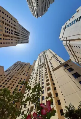 a view of two tall buildings in a city at La buena vida holiday homes - Deluxe 3 bedroom apartment on the beach in Dubai