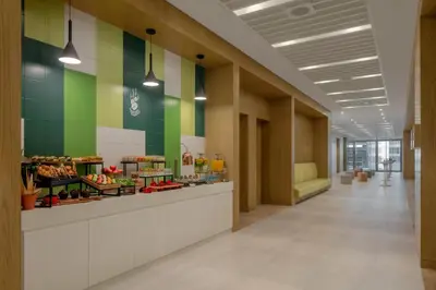 a bakery lobby with green and yellow tiles at Holiday Inn Dubai Business Bay by IHG in Dubai