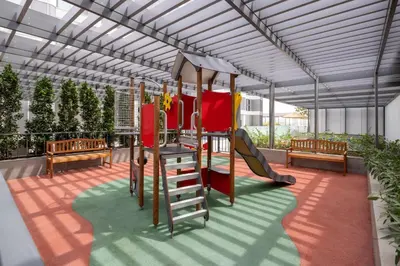 a playground with a slide and a swing set at Holiday Inn Dubai Business Bay by IHG in Dubai