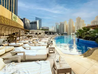 a hotel with a pool and a city skyline at Magnificent apartment in Emaar Dubai Marina in Dubai