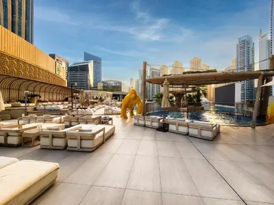 a view of a rooftop of a building with a pool at Magnificent apartment in Emaar Dubai Marina in Dubai