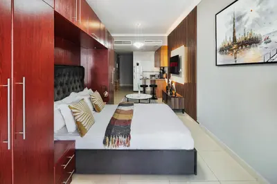 a bedroom with a large bed in a room at Furnished Apartment for Rent in Saba 3, JLT in Dubai
