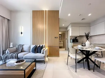 a living room with a couch and a table at Trophy - Downtown Skyview Residence in 35th floor in Dubai