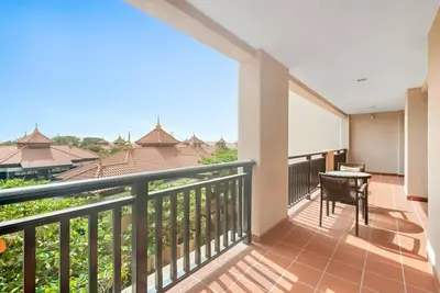 a balcony with a table and a view at StoneTree - Anantara South Residences 2 BR - Palm Jumeirah in Dubai