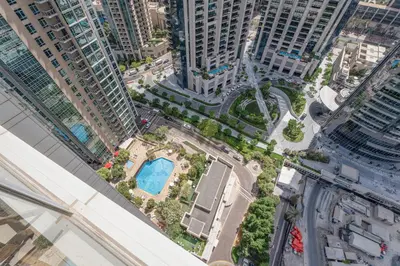 an aerial view of a city with tall buildings at INA HOMES - Residences Tower 1 Upper Floor in Dubai